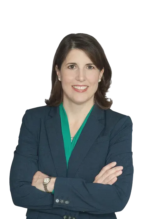 Professional headshot of Lauren Lobrano, an accessibility and disability inclusion executive, smiling and facing the camera against a neutral background.